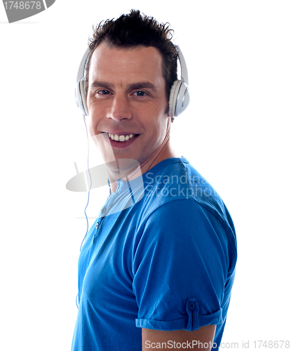 Image of Guy listening to music on music player