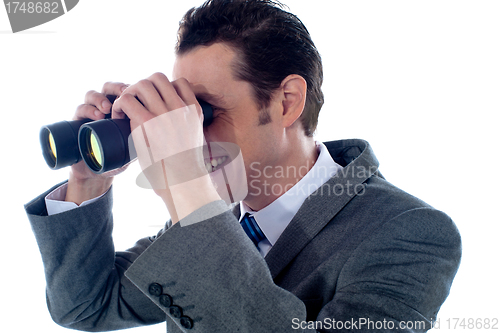 Image of Male executive using binoculars