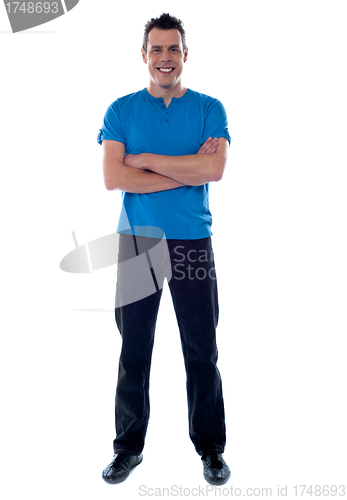 Image of Full shot of a guy with crossed arms
