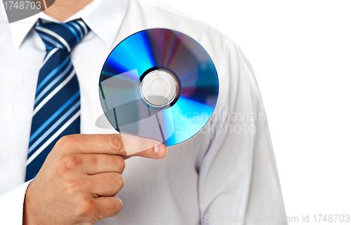 Image of Closeup of a man holding compact disc