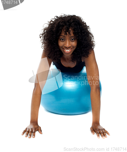 Image of Fit african woman exercising