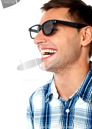Image of Side view of handsome smiling caucasian guy
