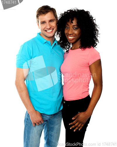 Image of Attractive smiling couple hugging