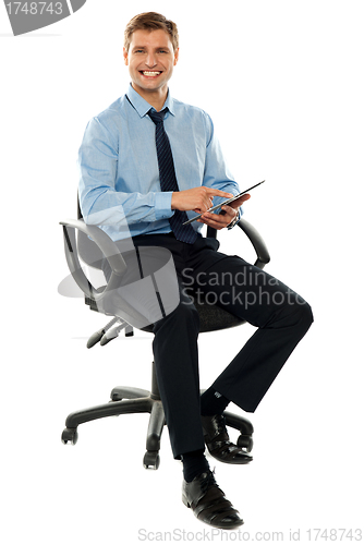 Image of Corporate man working on touch pad device