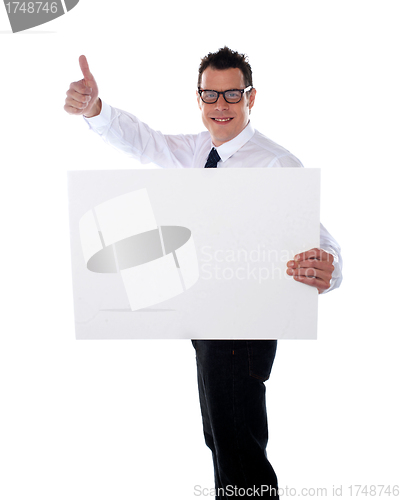 Image of Thumbs up businessman holding banner ad