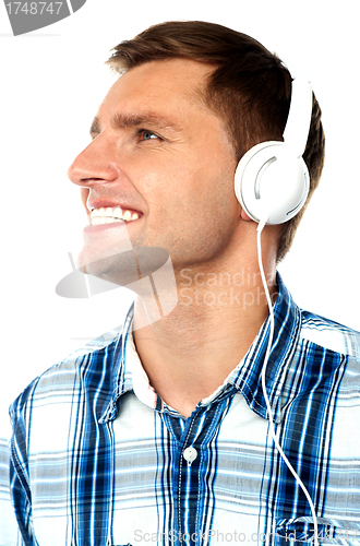 Image of Young man tuned into music