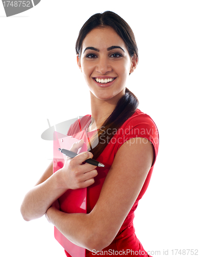 Image of Smiling modern girl holding clipboard