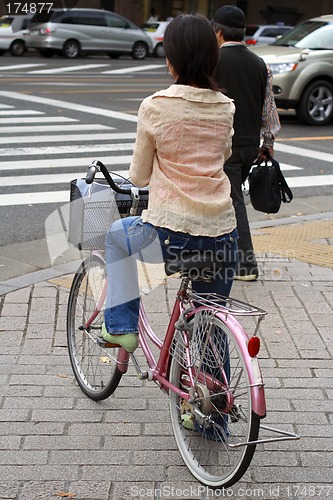 Image of Japanese woman riding bicycle