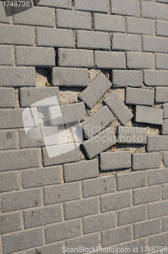 Image of Small tiled sidewalk without few ones.