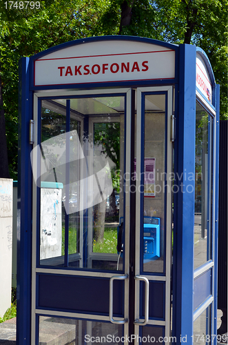 Image of Calling phone cabin. Pay telephone service 