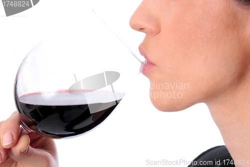 Image of Woman with red wine glass on lips