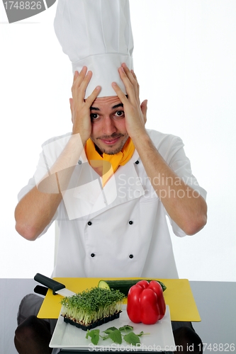 Image of Bewildered chef with ingredients