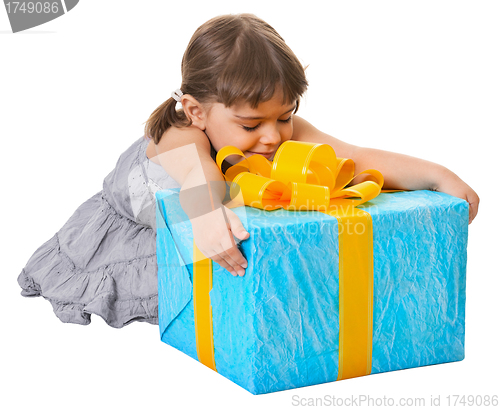 Image of Happy child embraces large birthday gift