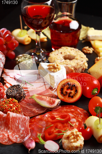 Image of Antipasto catering platter with red wine