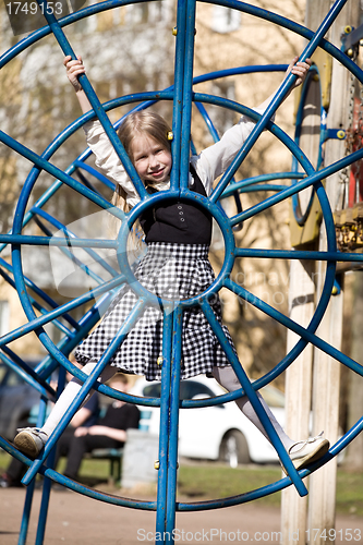 Image of closeup of little girl on outdoor playground