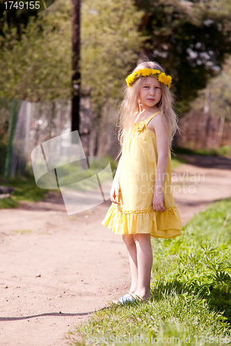 Image of little girl in dandelion wreath