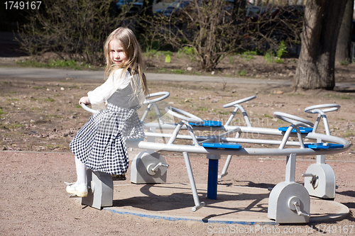 Image of little girl on outdoor playground