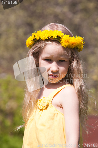 Image of little fair-haired girl in dandelion wreath