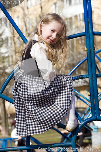 Image of little girl on outdoor playground