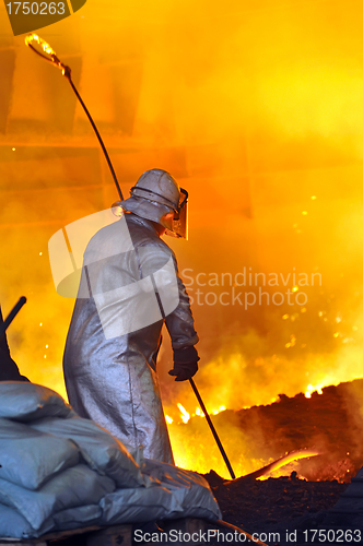 Image of worker with hot steel 