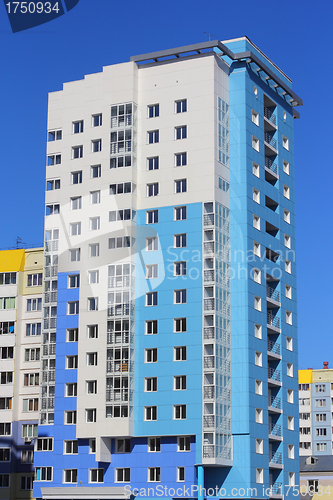 Image of The inhabited high house against the blue sky