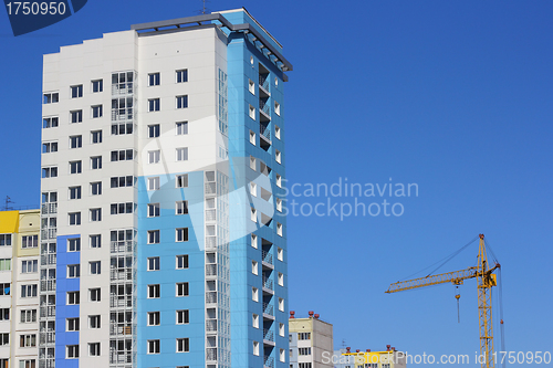 Image of The inhabited high house against the blue sky
