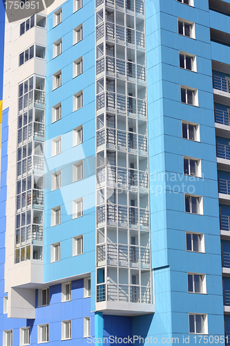 Image of The inhabited high house against the blue sky