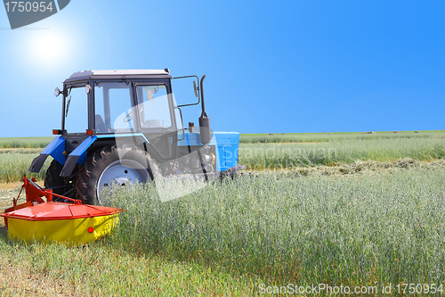 Image of Tractor in a field, agricultural scene in summer