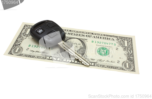 Image of The car key lies on a dollar denomination