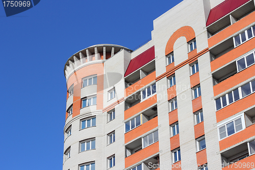 Image of The inhabited high house against the blue sky