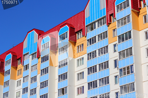 Image of The inhabited high house against the blue sky