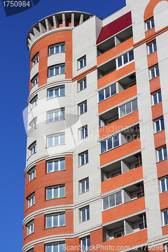 Image of The inhabited high house against the blue sky