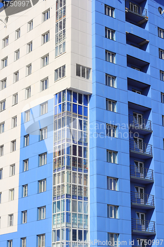 Image of The inhabited high house against the blue sky