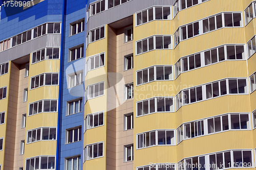Image of The inhabited high house against the blue sky