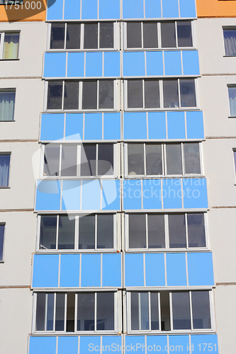 Image of The inhabited high house against the blue sky