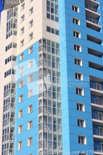 Image of The inhabited high house against the blue sky