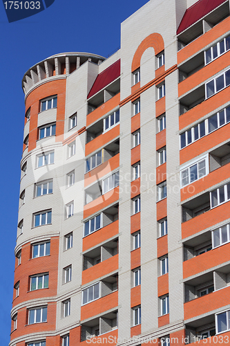 Image of The inhabited high house against the blue sky