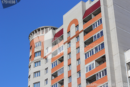 Image of The inhabited high house against the blue sky