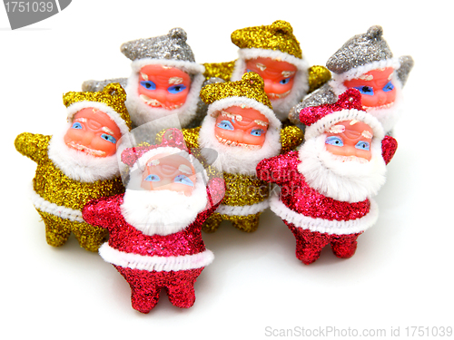 Image of Some dolls of Santa Claus are together 