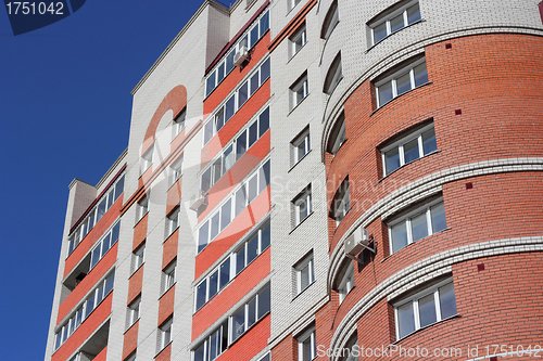Image of The inhabited high house against the blue sky