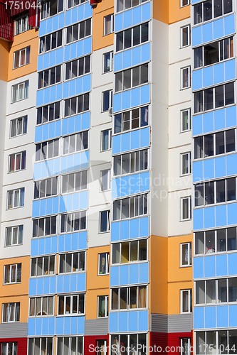 Image of The inhabited high house against the blue sky