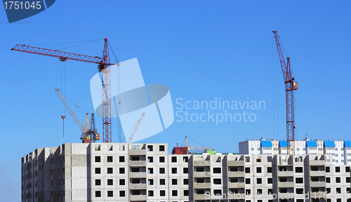 Image of  crane and blue sky on building site