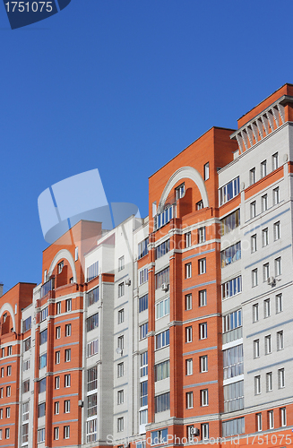 Image of The inhabited high house against the blue sky