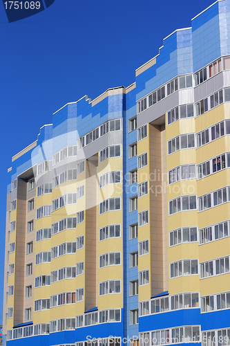 Image of The inhabited high house against the blue sky