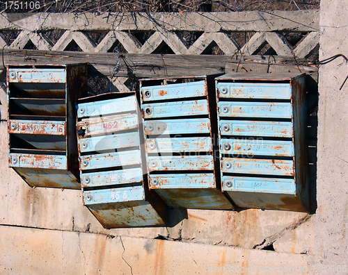 Image of Old mailboxes are on the fence