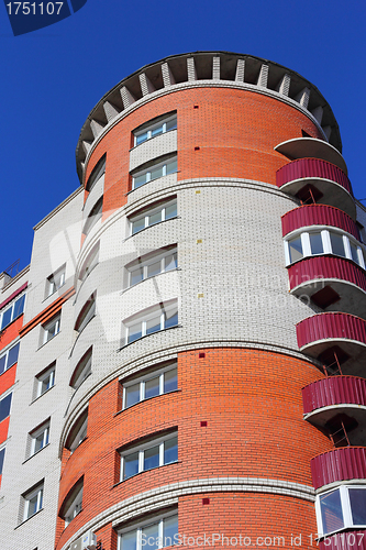 Image of The inhabited high house against the blue sky