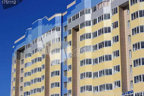 Image of The inhabited high house against the blue sky