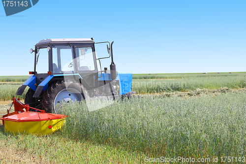 Image of Tractor in a field, agricultural scene in summer