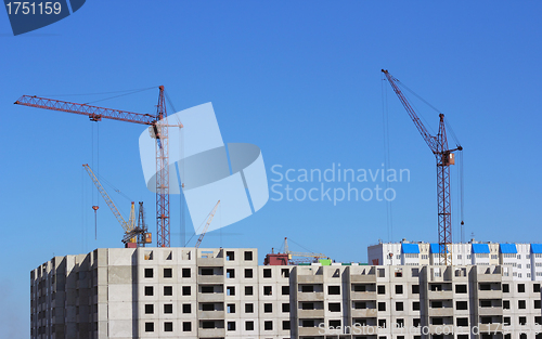 Image of  crane and blue sky on building site