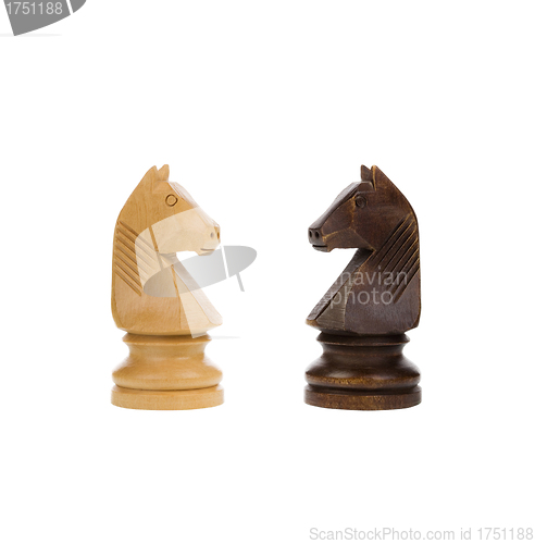 Image of White and black knights on chess board